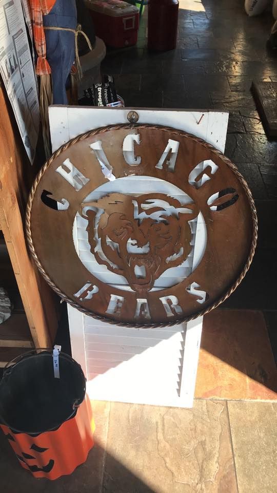 A chicago bears sign is sitting on top of a white box.