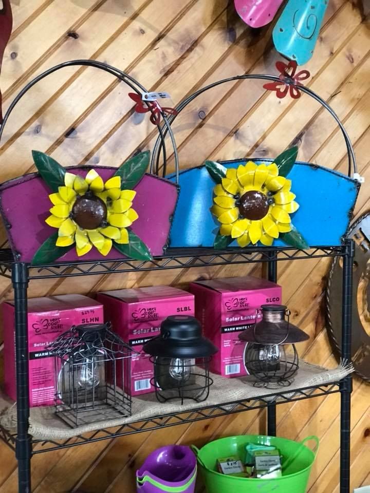 A shelf with a bunch of sunflowers on it