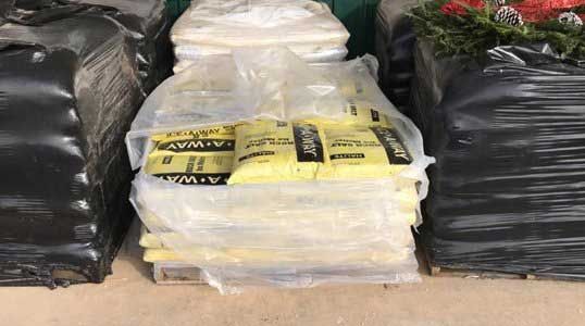 A stack of bags sitting next to each other on a table.