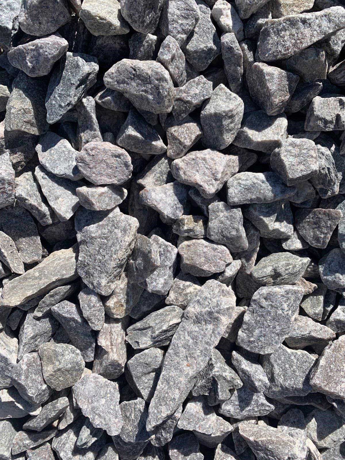 A pile of rocks sitting on top of each other on a sunny day.