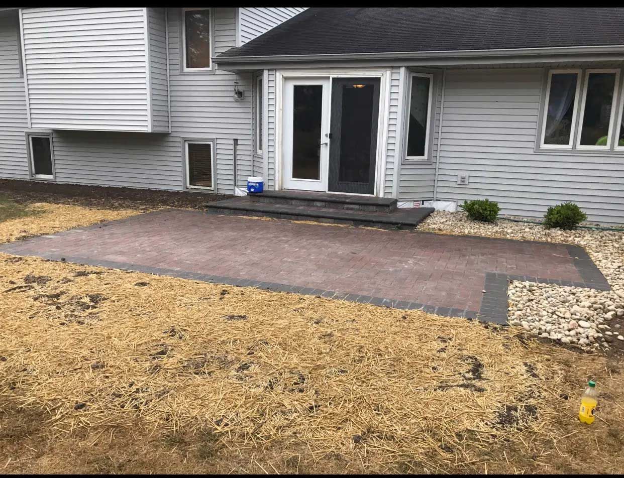 A house with a patio in front of it.