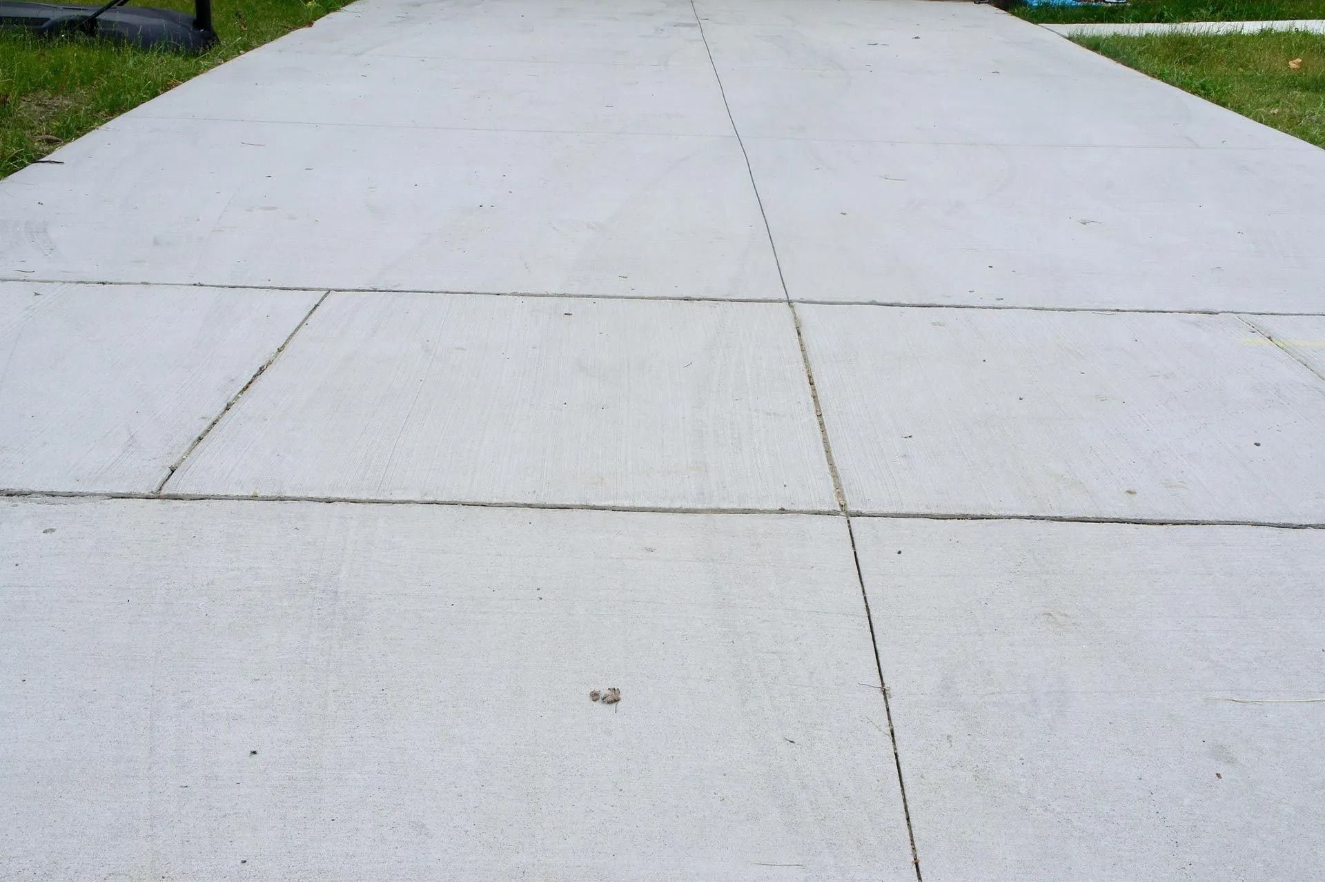 Concrete sidewalk with evenly spaced expansion joints.