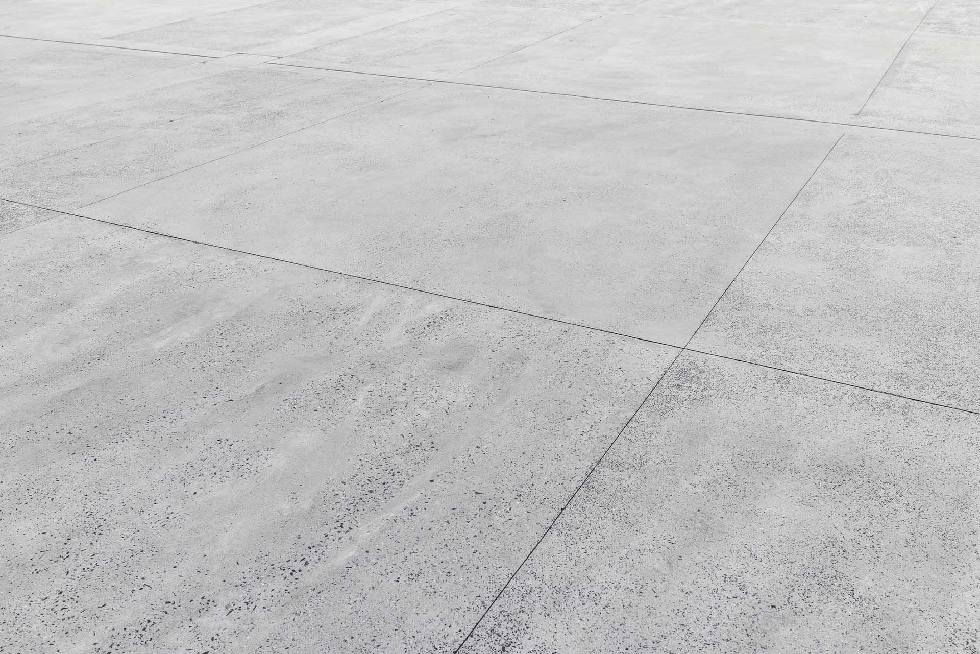 Gray concrete surface with grid lines.