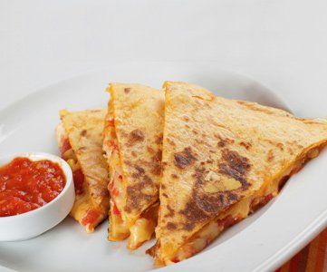 Tasty quesadillas and sauce on a plate