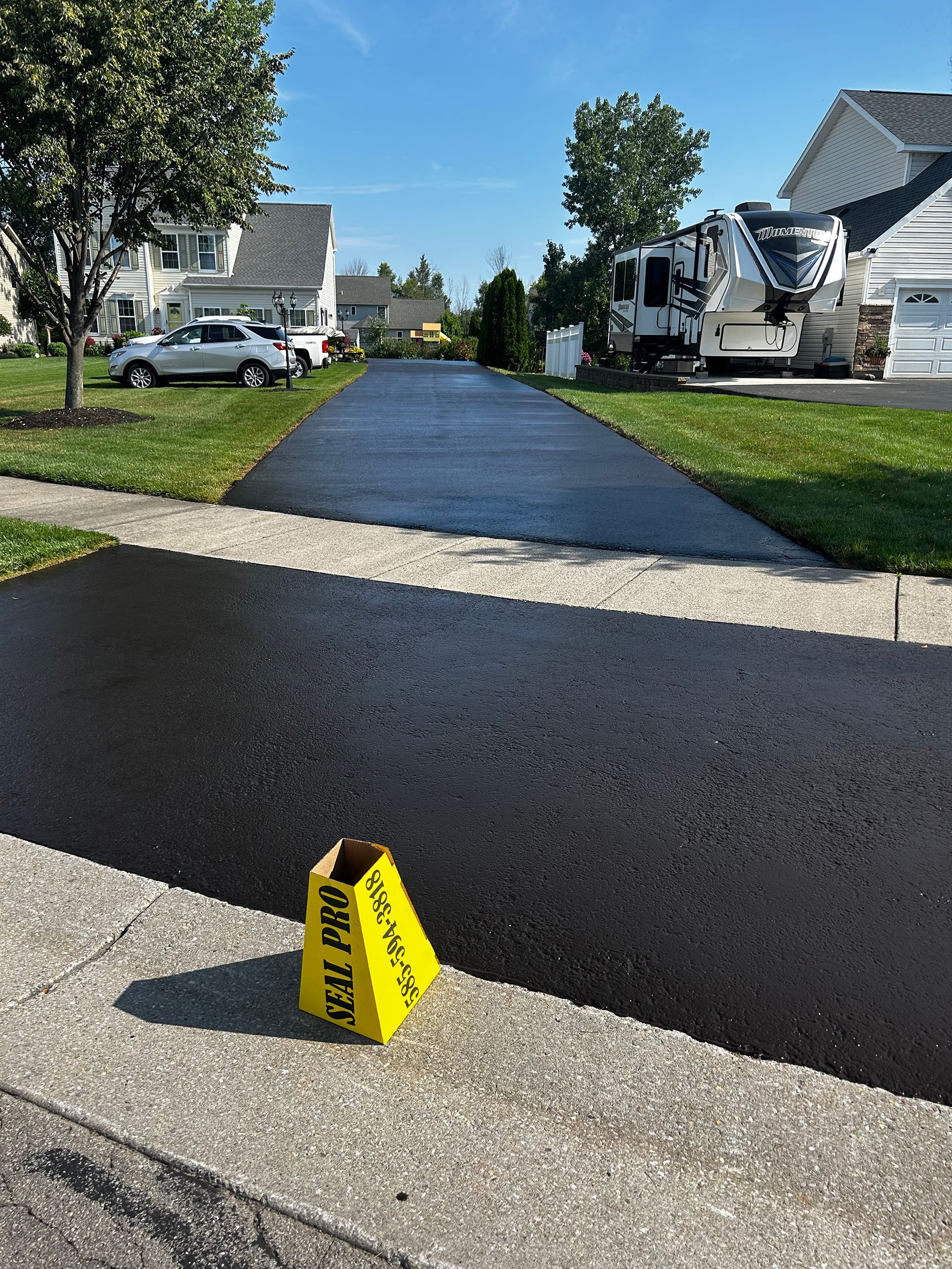 a yellow cone with the word pro on it is sitting on the side of a road