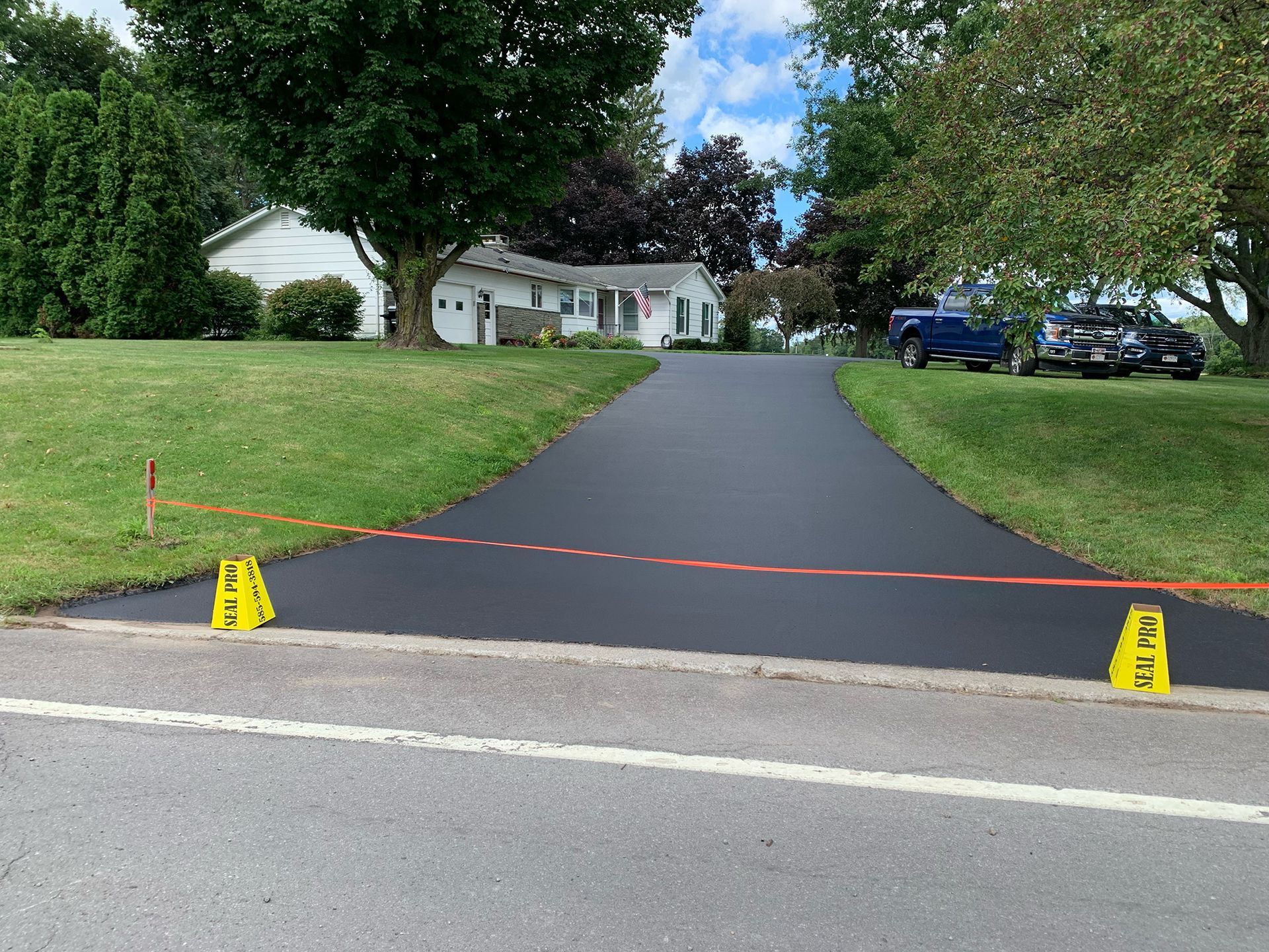 a driveway is being paved in front of a house