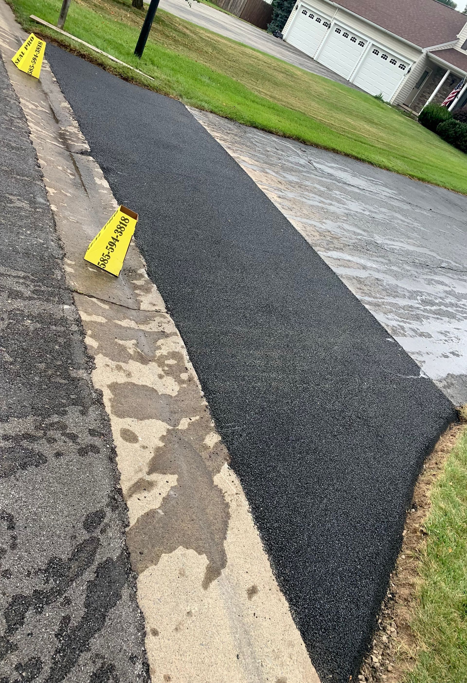 a sidewalk is being built on the side of a road