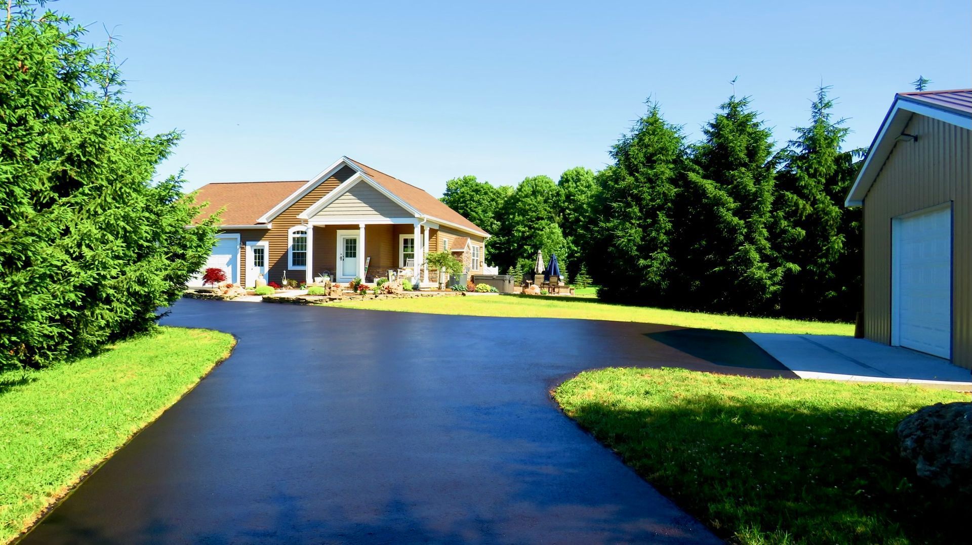 a house with a garage and a driveway in front of it