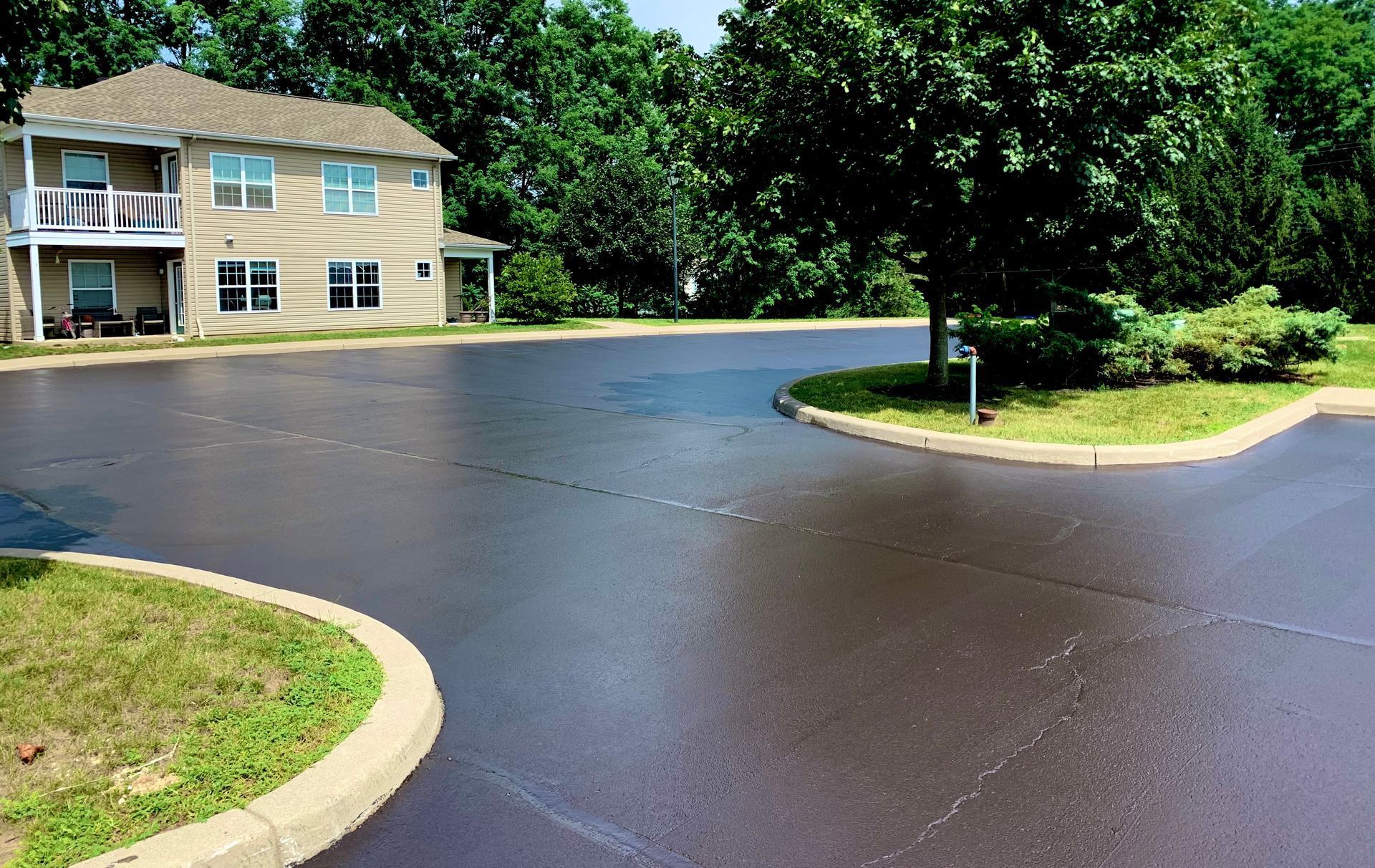 a large house sits in the middle of a parking lot