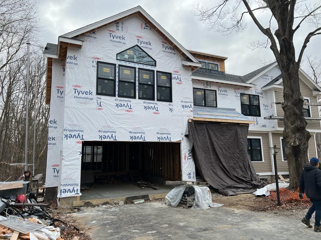 a large house is being built with a lot of windows