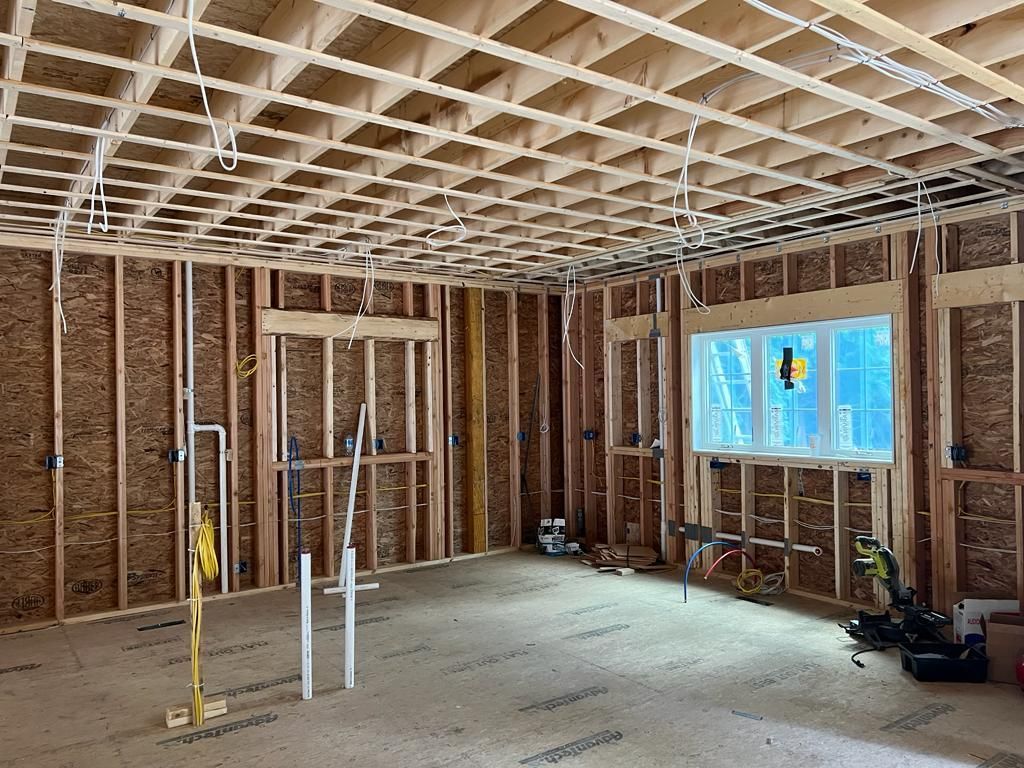 a room with a lot of wooden beams and a ceiling