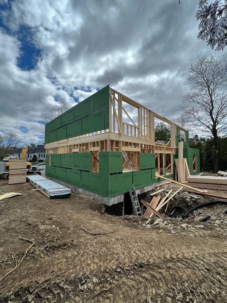 a house is being built in the middle of a dirt field