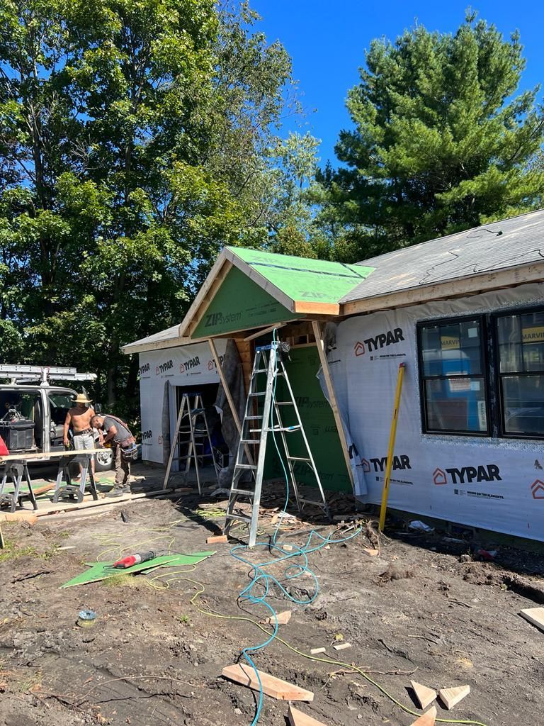 a house is being remodeled with a green roof