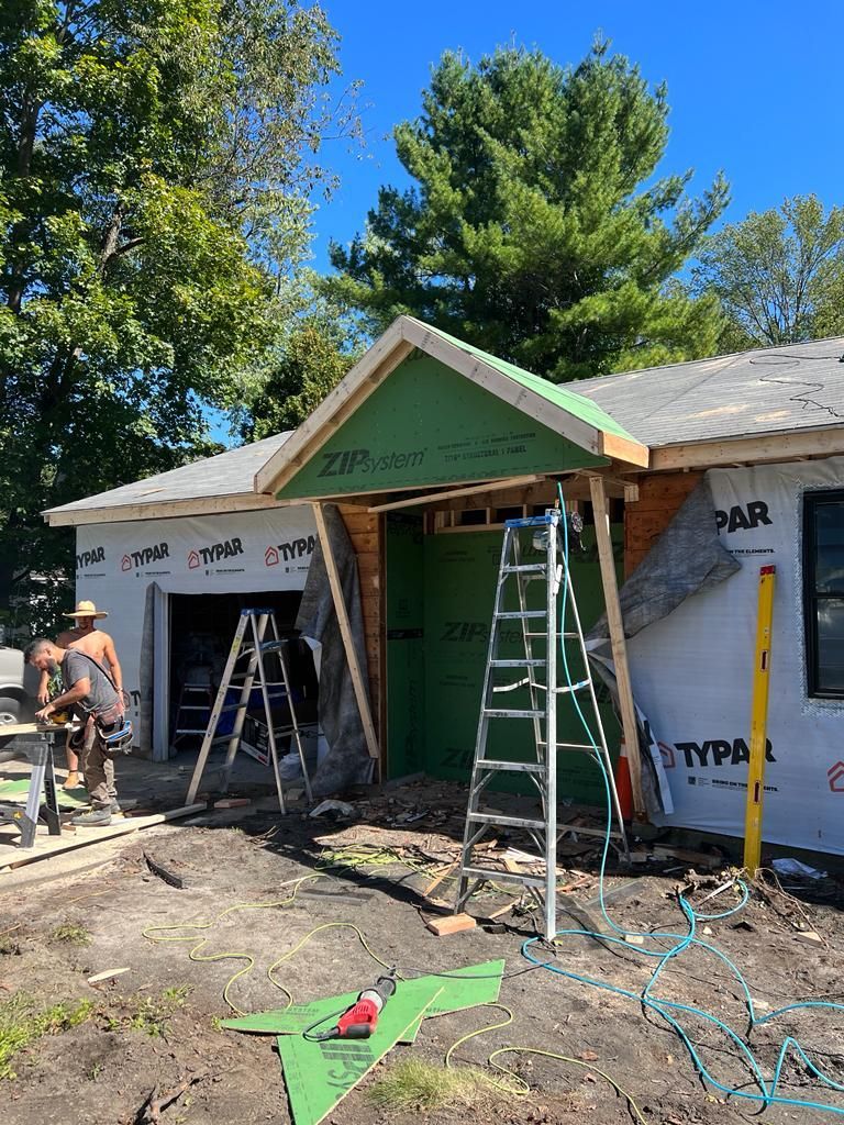 a house is being remodeled with a green roof