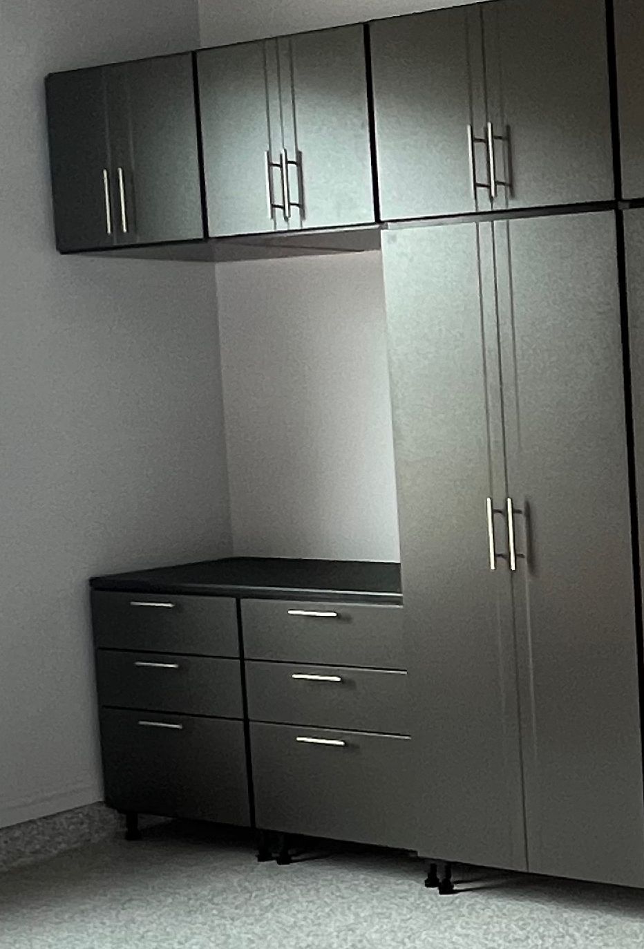 A room with a lot of cabinets and drawers