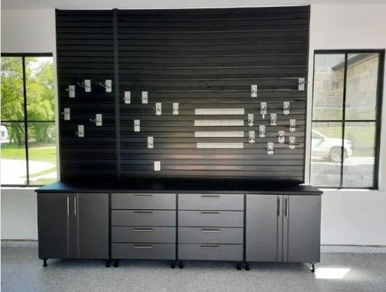 A garage with a lot of cabinets and drawers