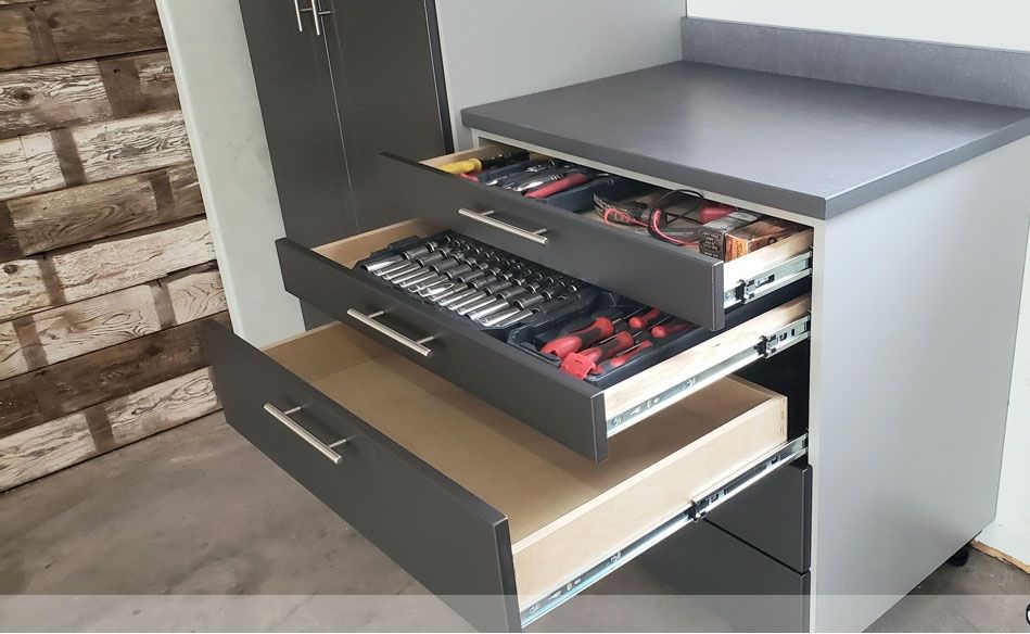 The drawers are open and filled with tools.