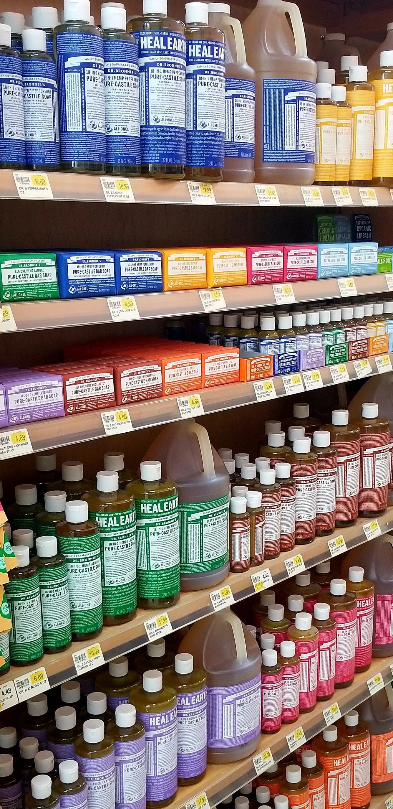 Shelves stocked with various bottles of cleaning products in a store.