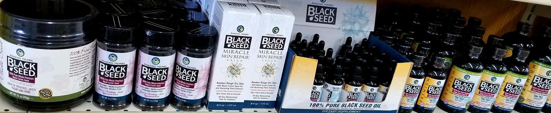 Bottles of various beverages on a shelf, with label text visible.