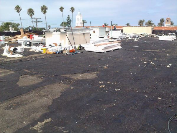 A roof with a lot of junk on it