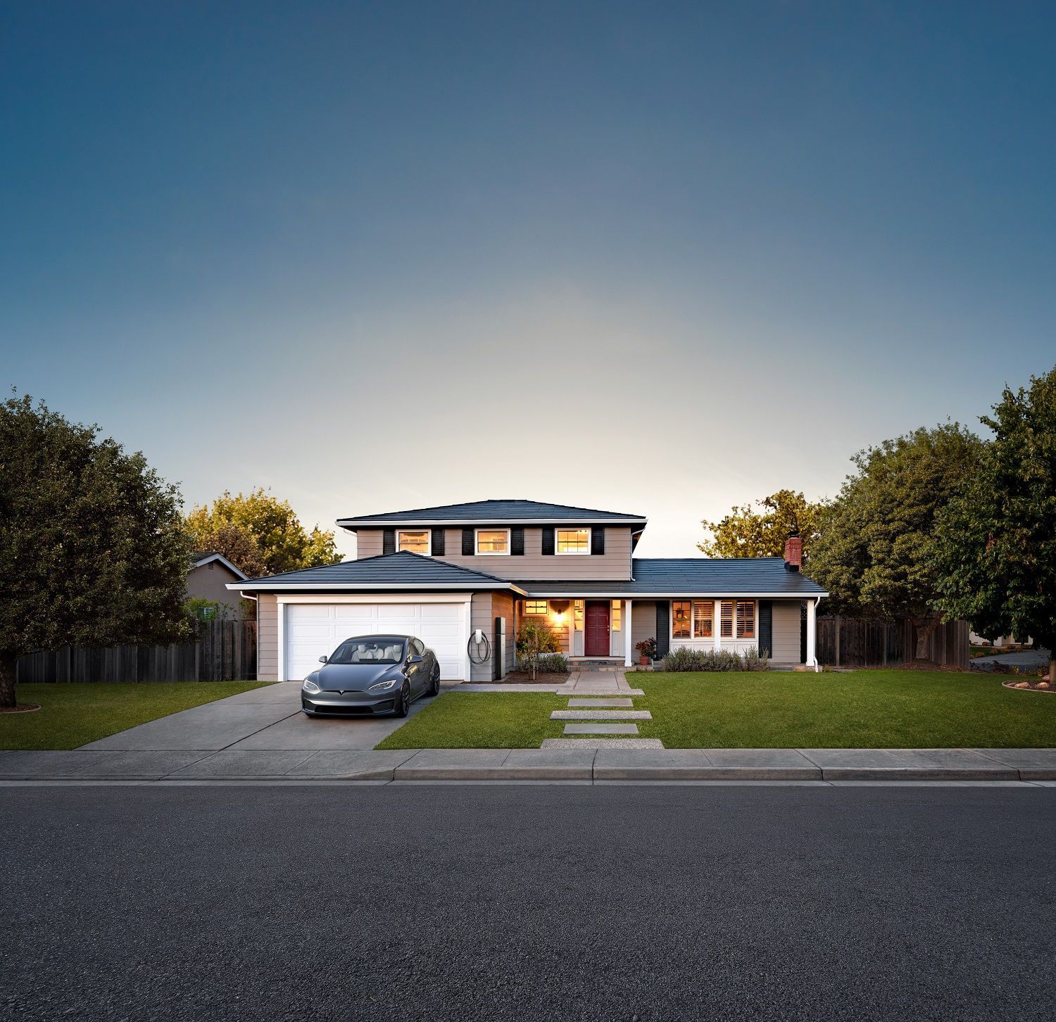 A house with a car parked in front of it