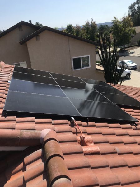 A roof with a lot of solar panels on it