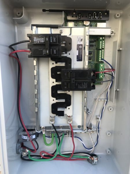 The inside of a box with wires connected to it