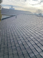 A close up of a roof with a lot of tiles on it.
