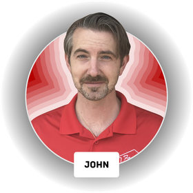 A man in a red shirt with the name john on it