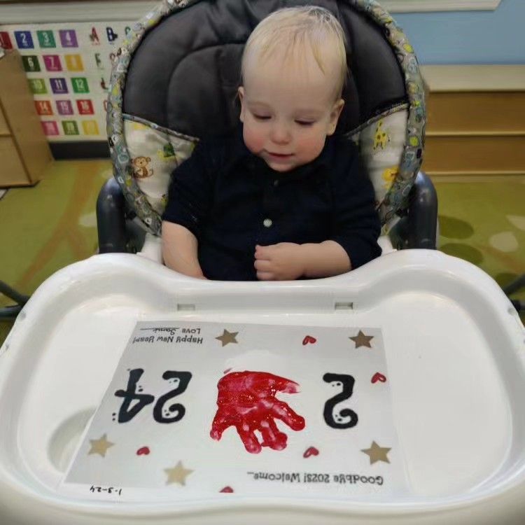 A baby is sitting in a high chair