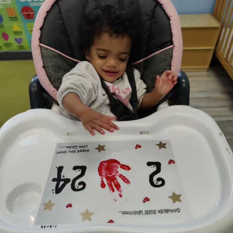 A baby is sitting in a high chair