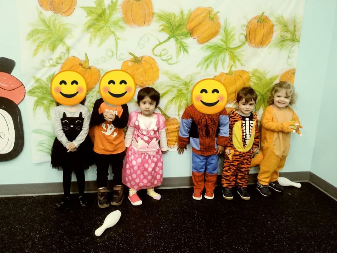A group of children with smiley faces on their faces