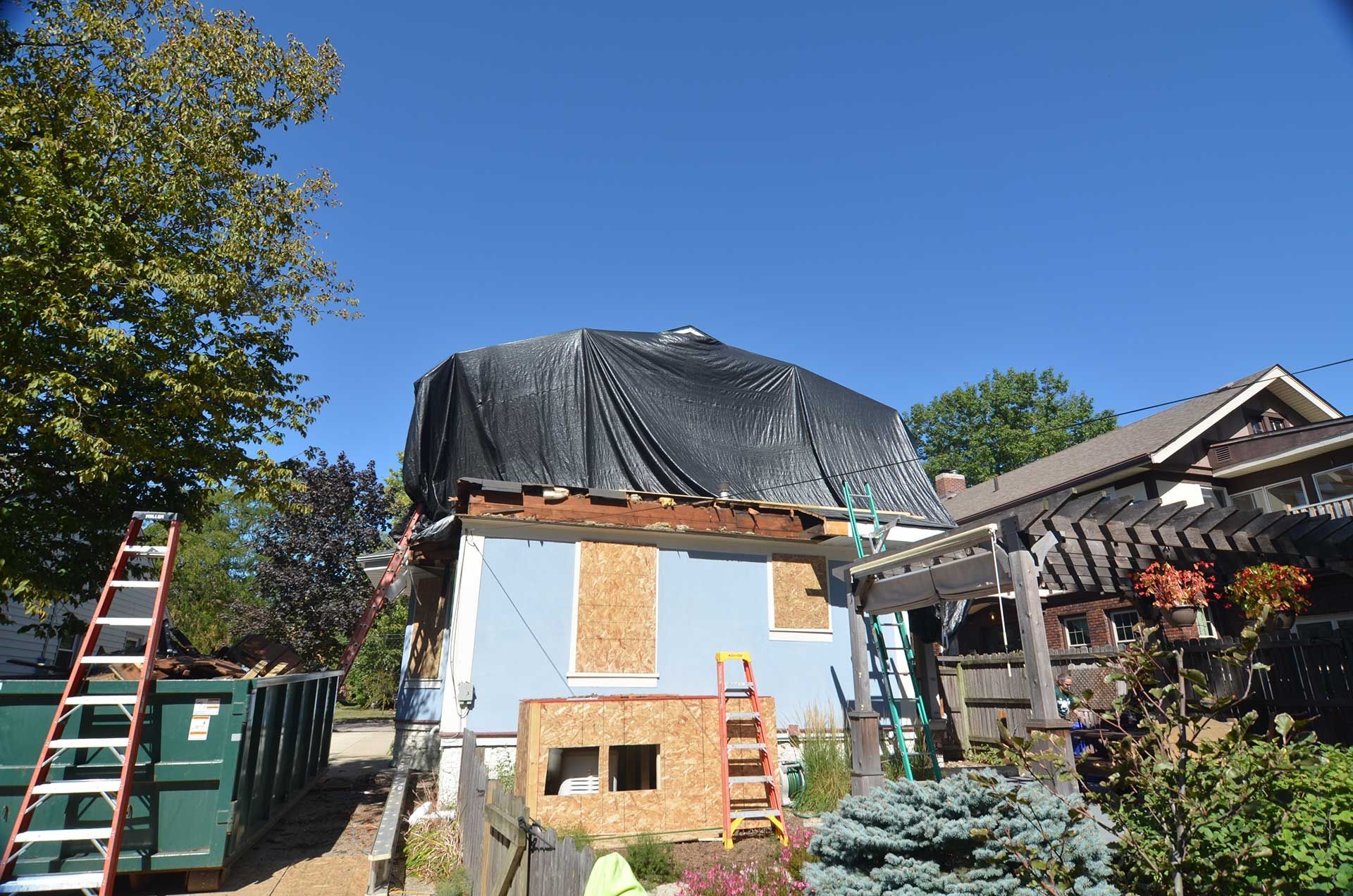 Plastic covering second floor of house