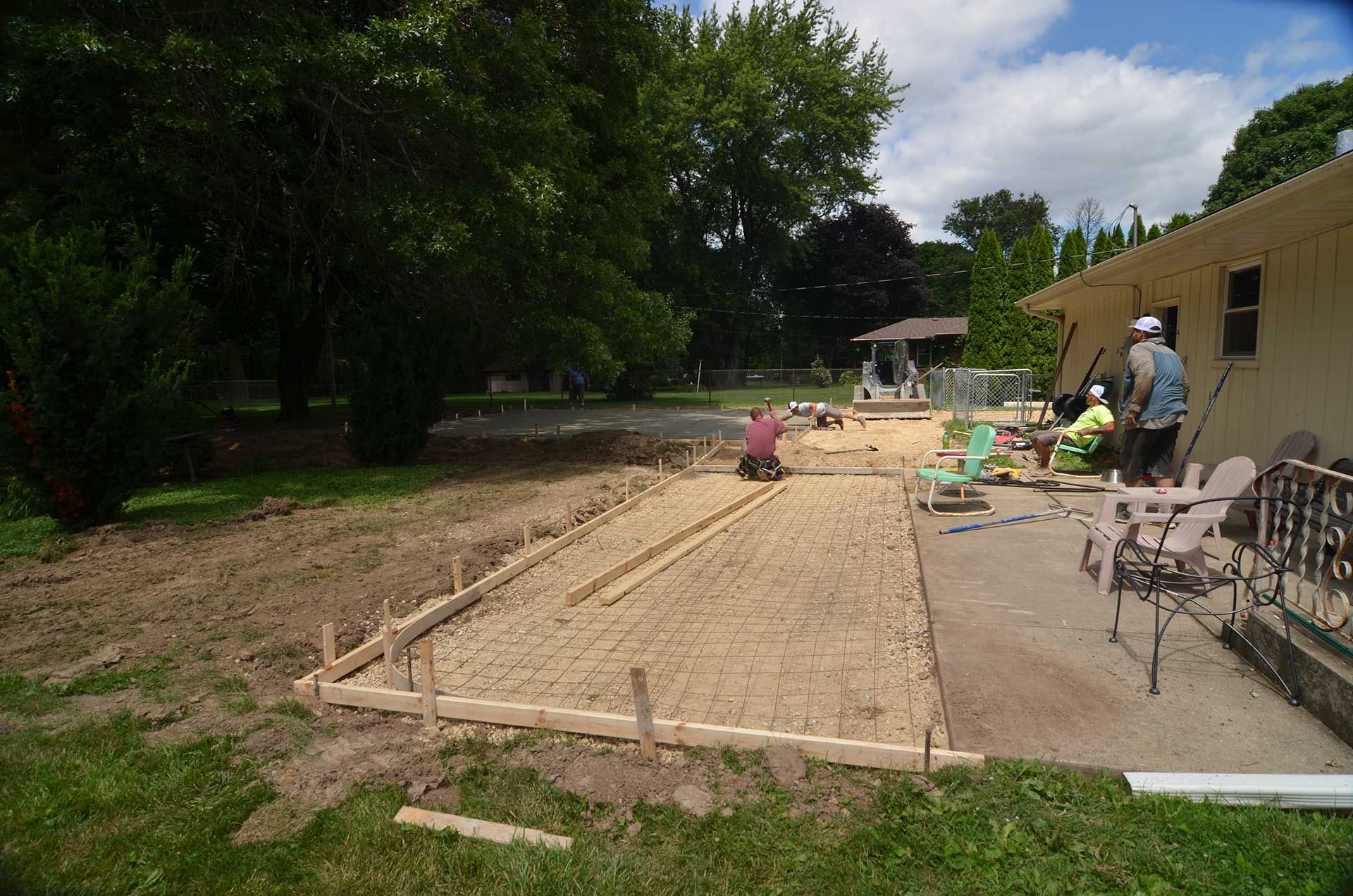 Workers preparing the porch extension