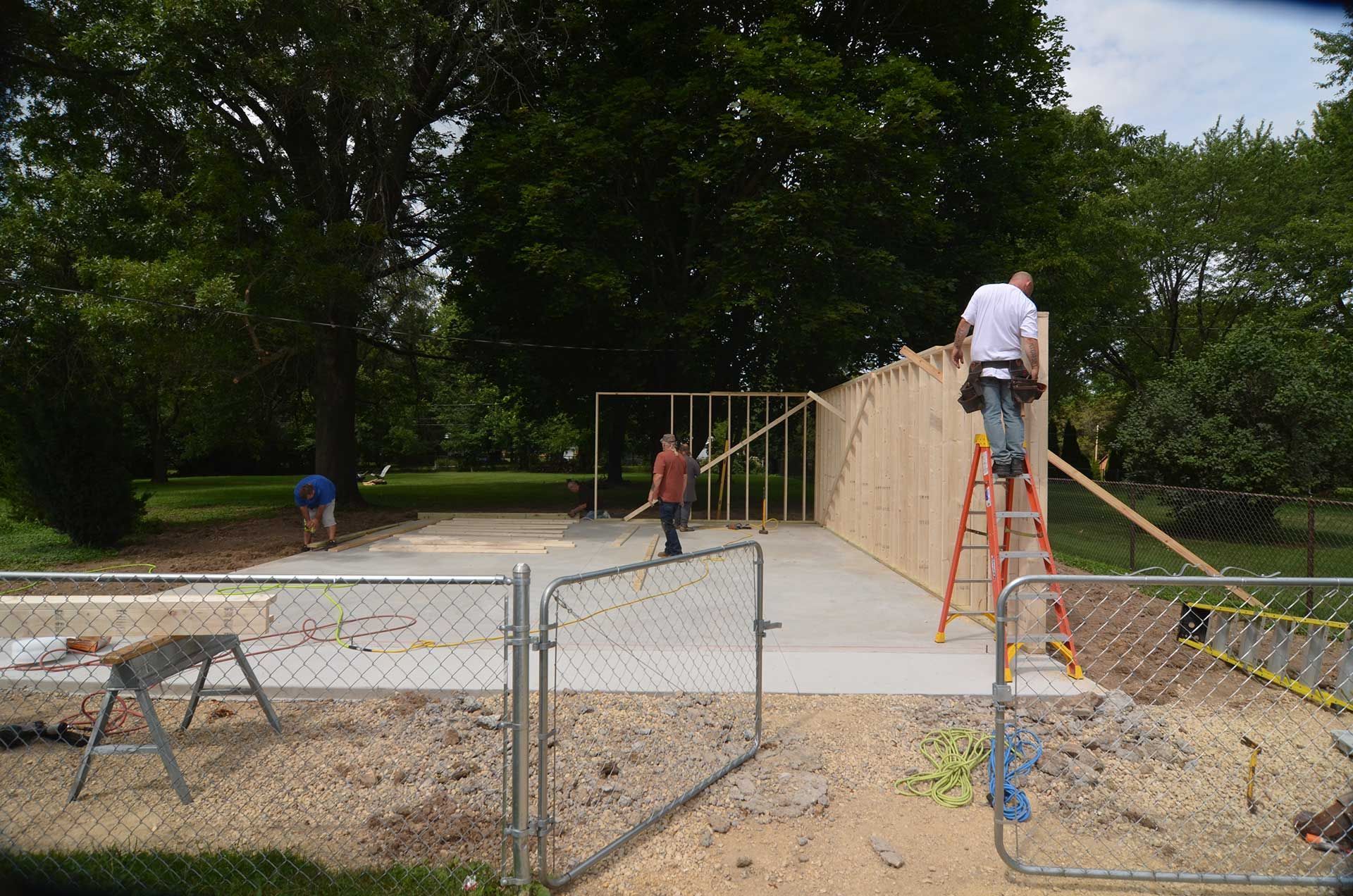 Workers installing wooden frames