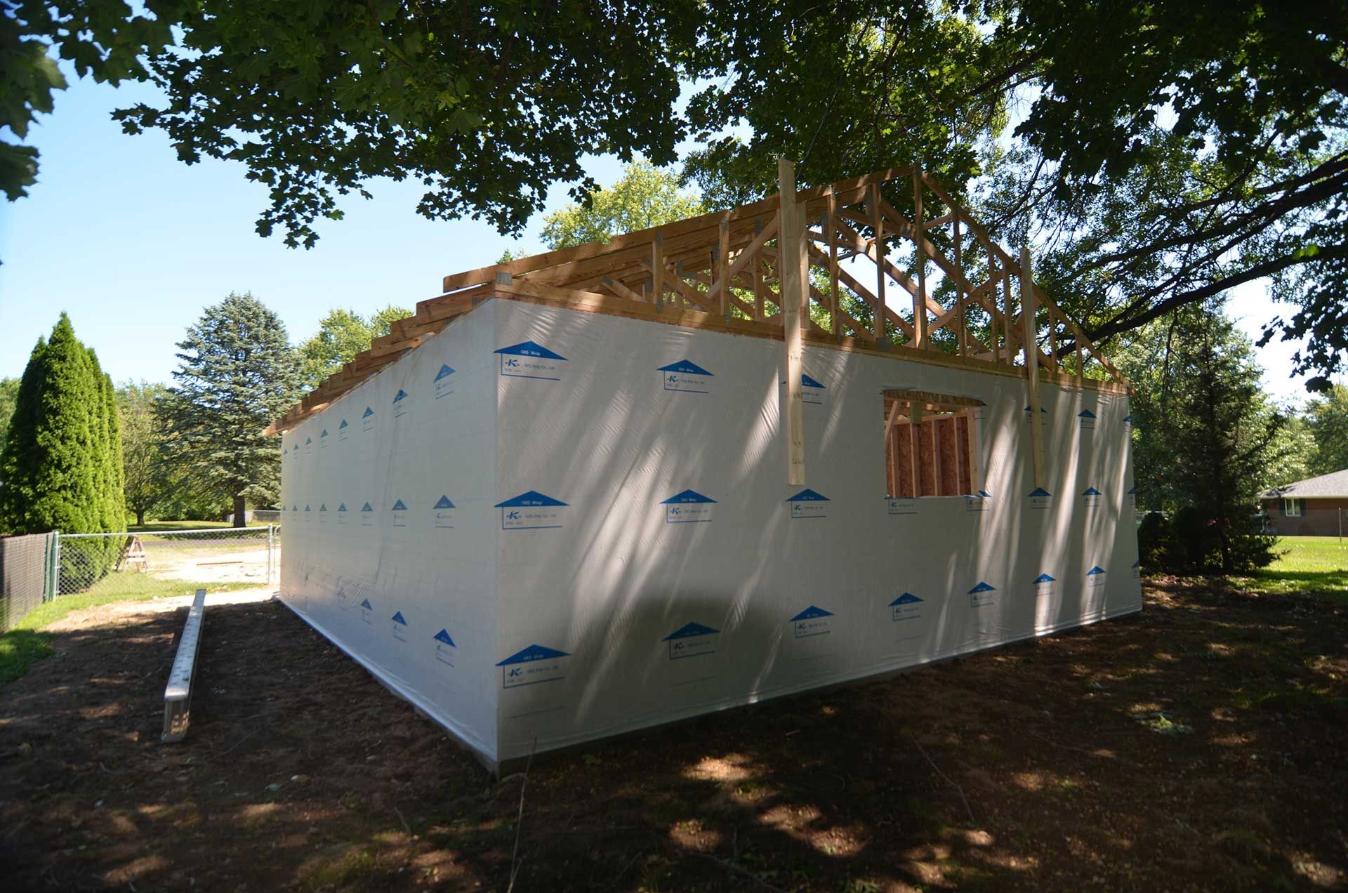 Garage covered in house wrap