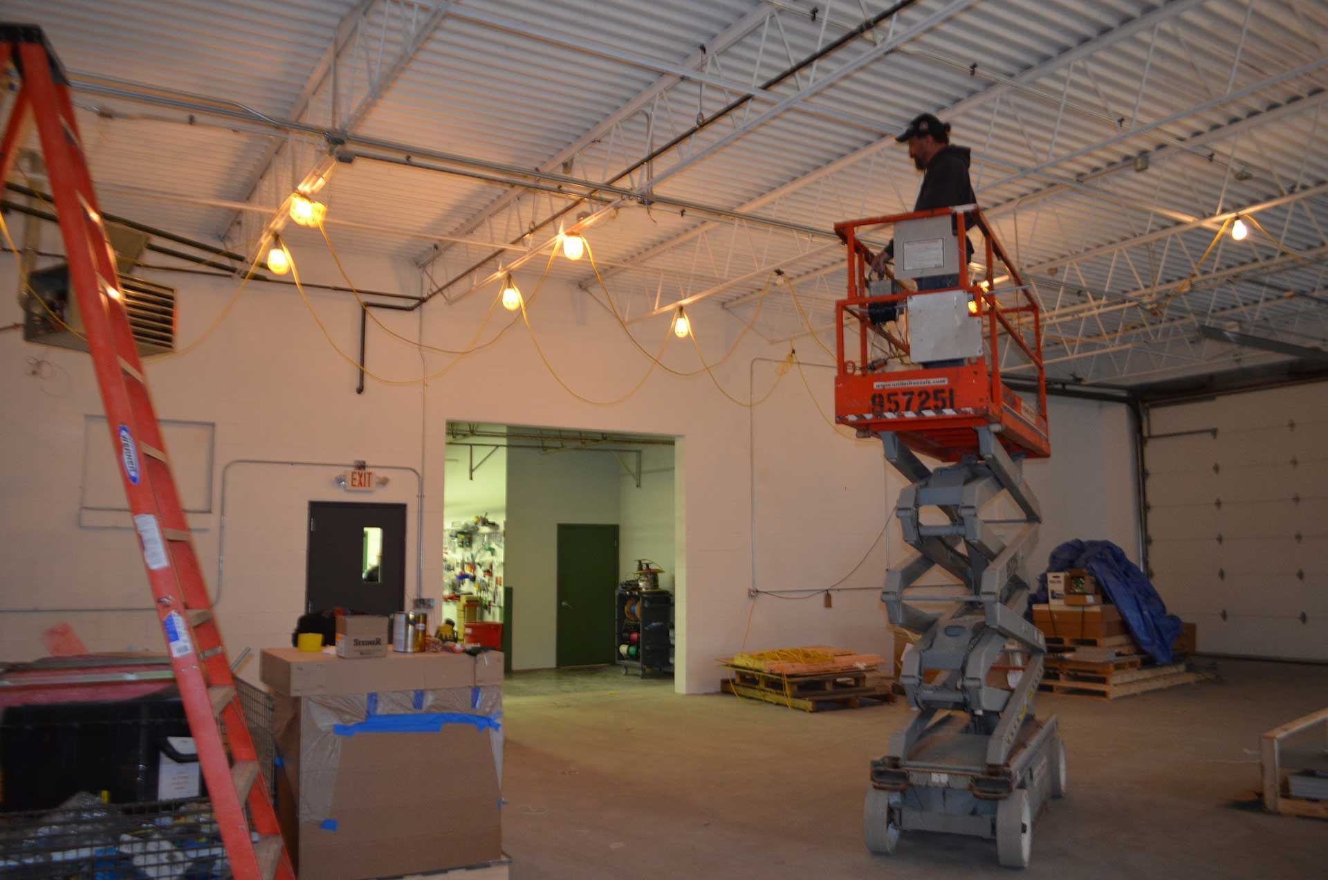 Man riding a scissor lift