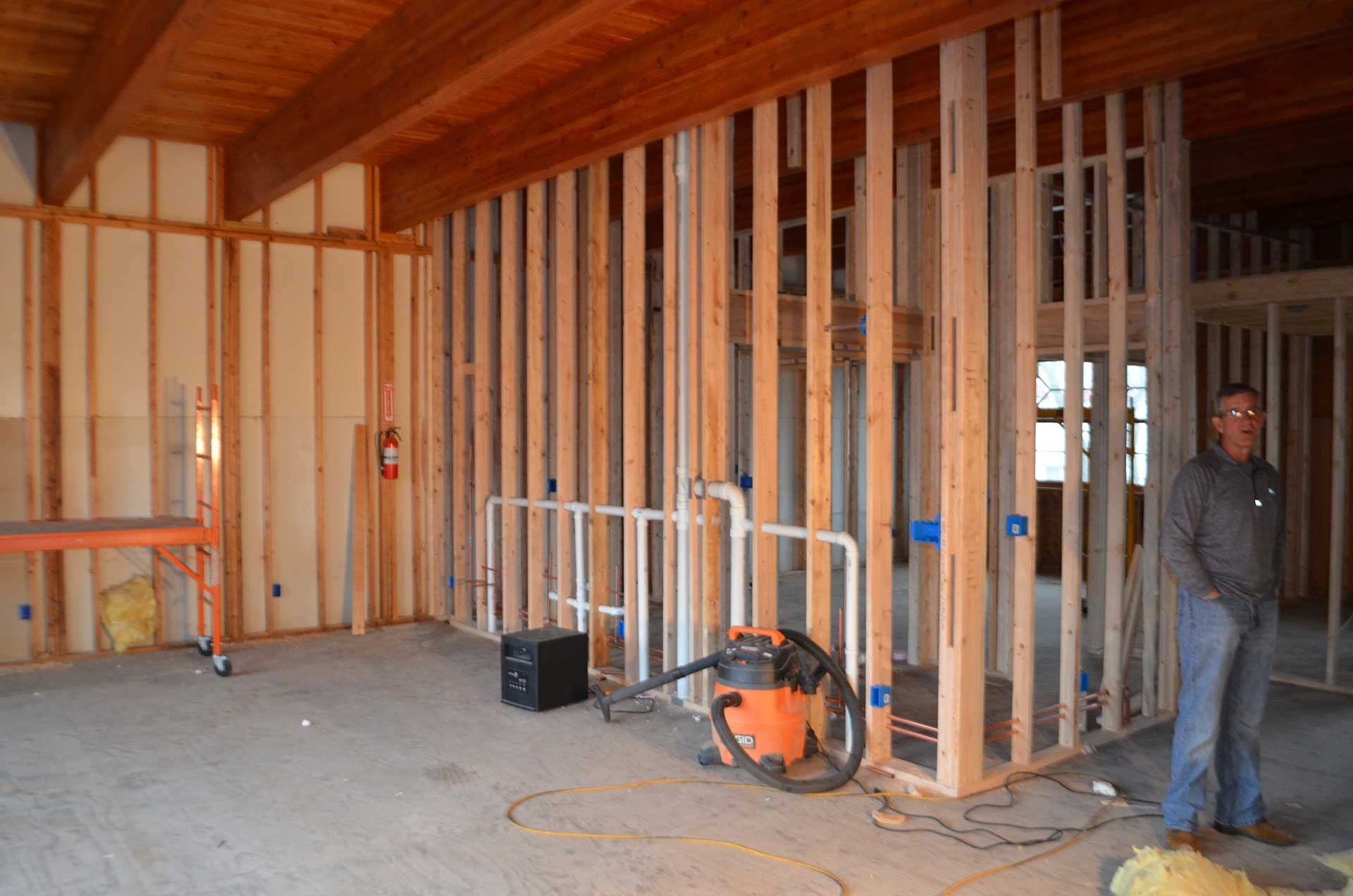 Man standing beside the wooden frames
