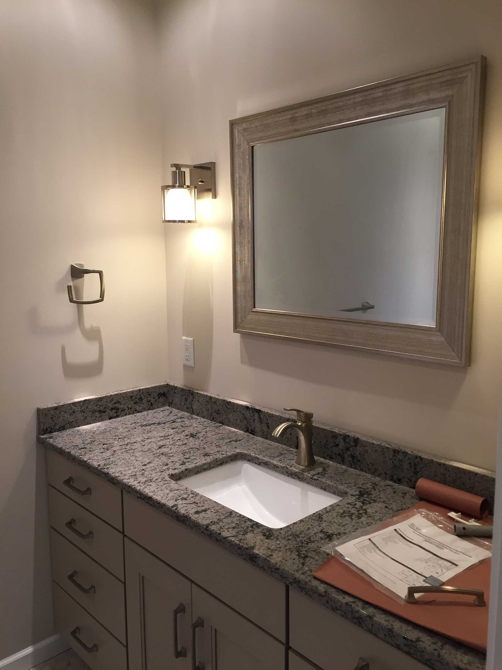 Installing handles on a new bathroom cabinet