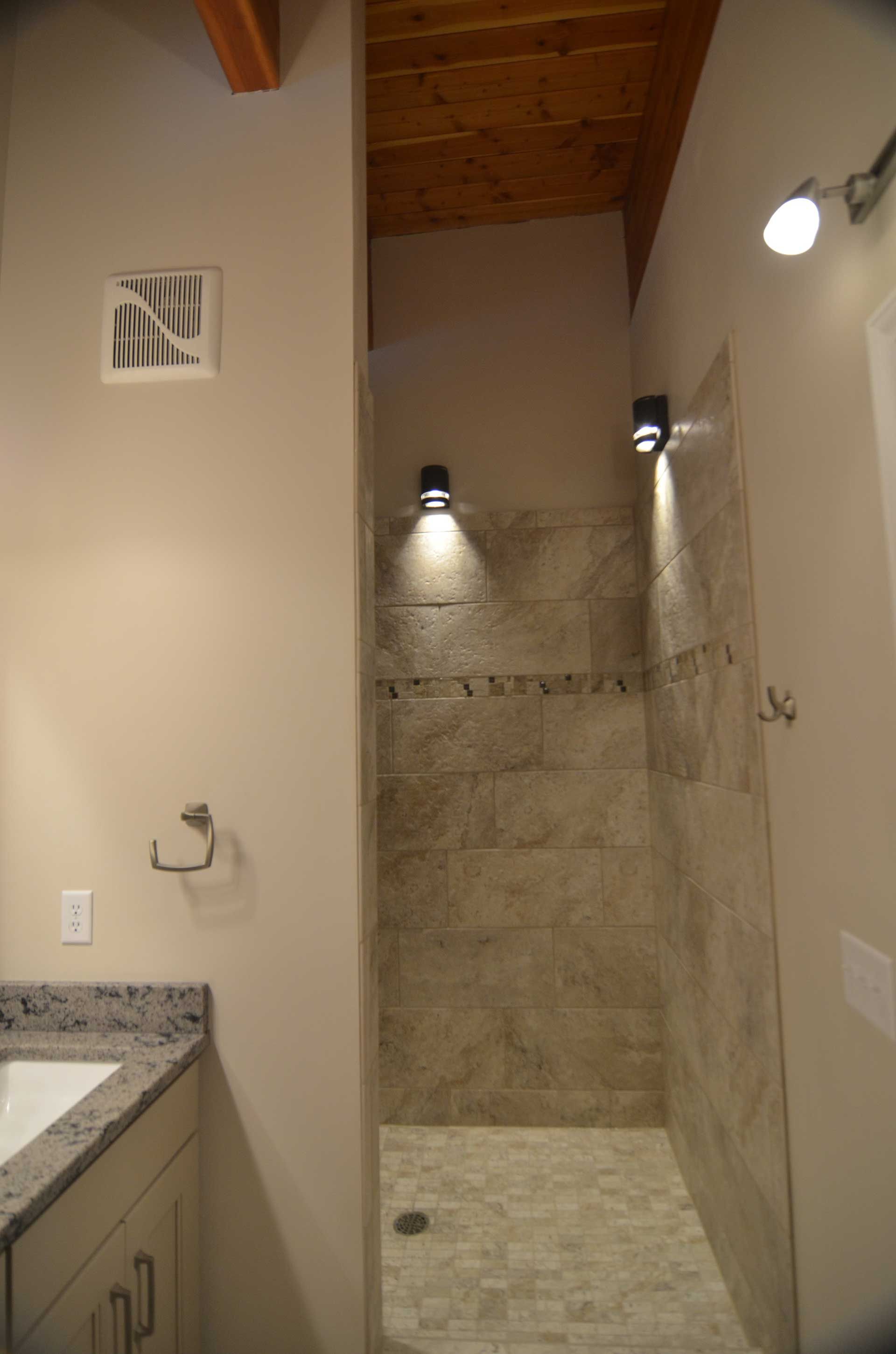 Shower area with lighting fixtures