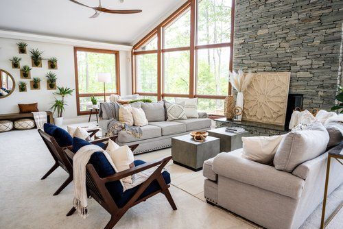 A living room filled with furniture and a fireplace.
