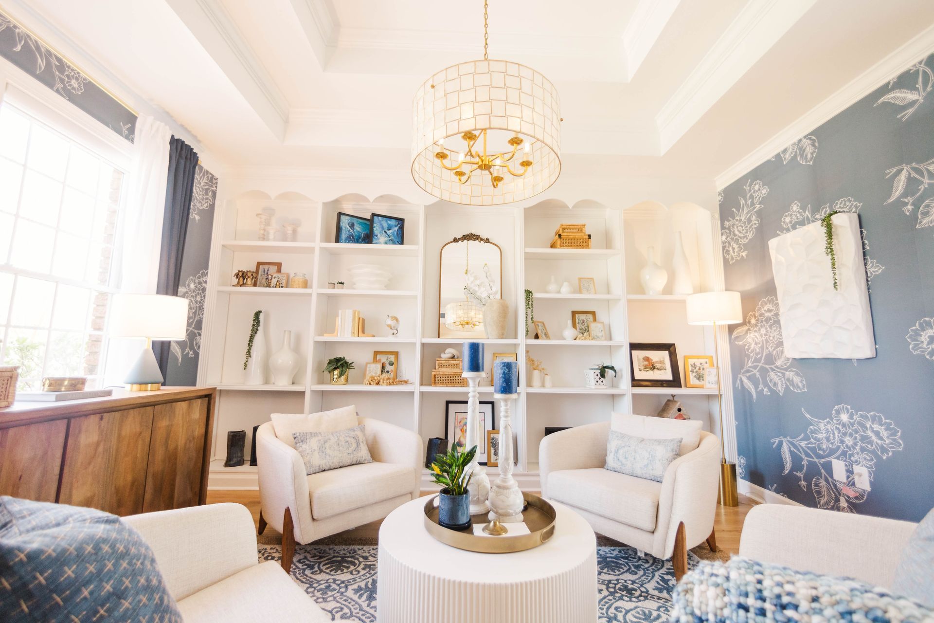 A living room filled with furniture and a chandelier.