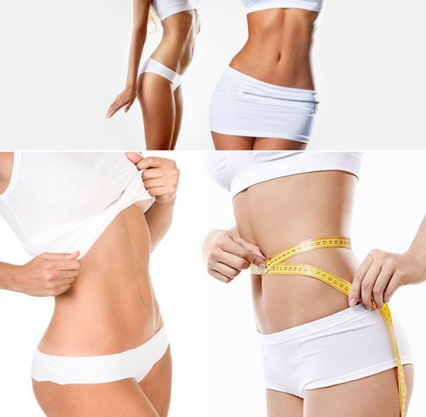 A woman is measuring her waist with a tape measure