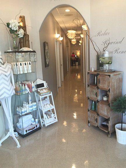 A hallway with a sign on the wall that says relax