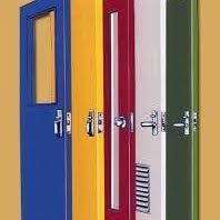 Four brightly colored doors: blue, yellow, red, white, and green with various handles and window inserts.