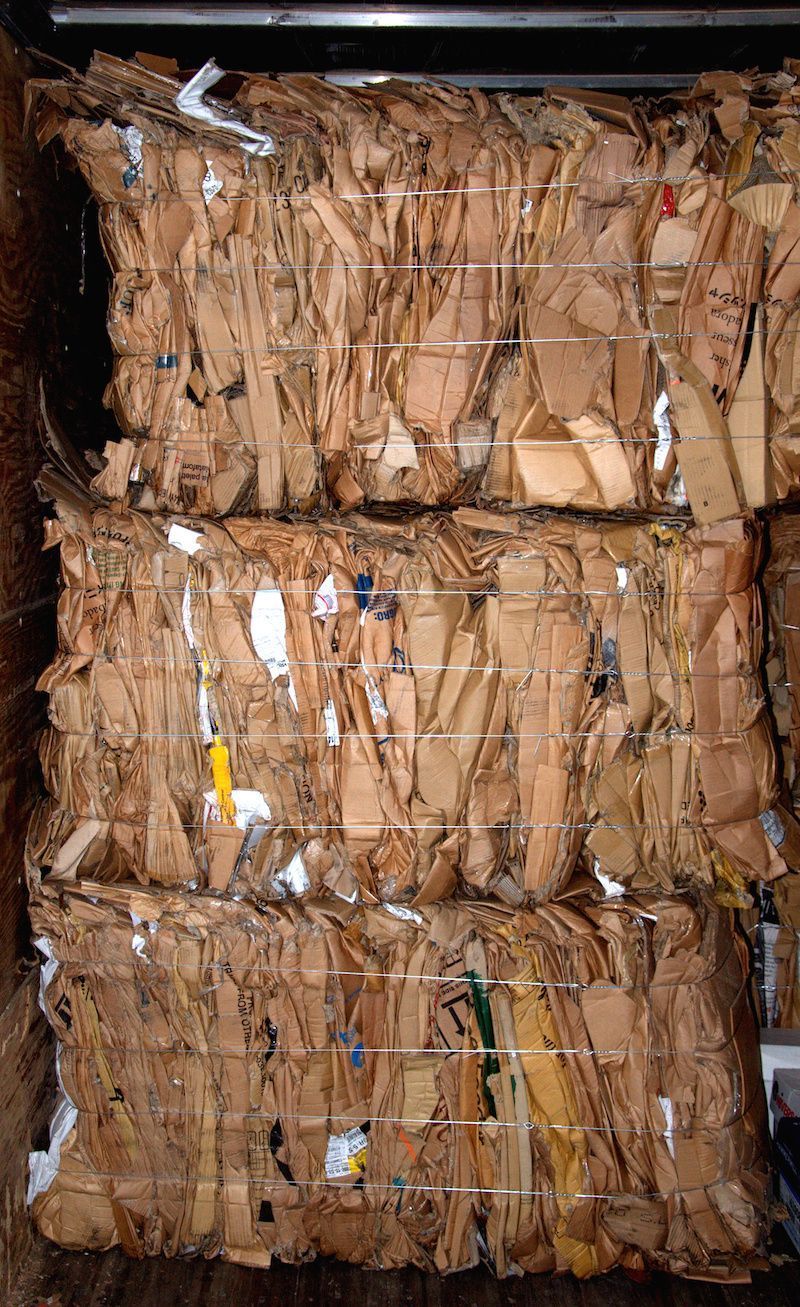 A pile of cardboard bales stacked on top of each other.