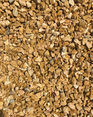 Close-up of golden brown gravel stones, filling the frame.
