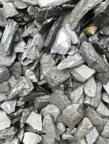 Pile of gray and blue slate rock, angled and irregular.