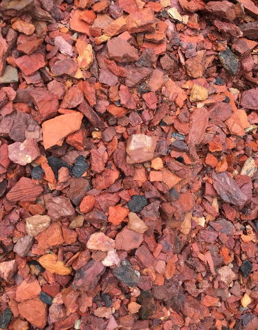 Red and orange crushed stone mulch.
