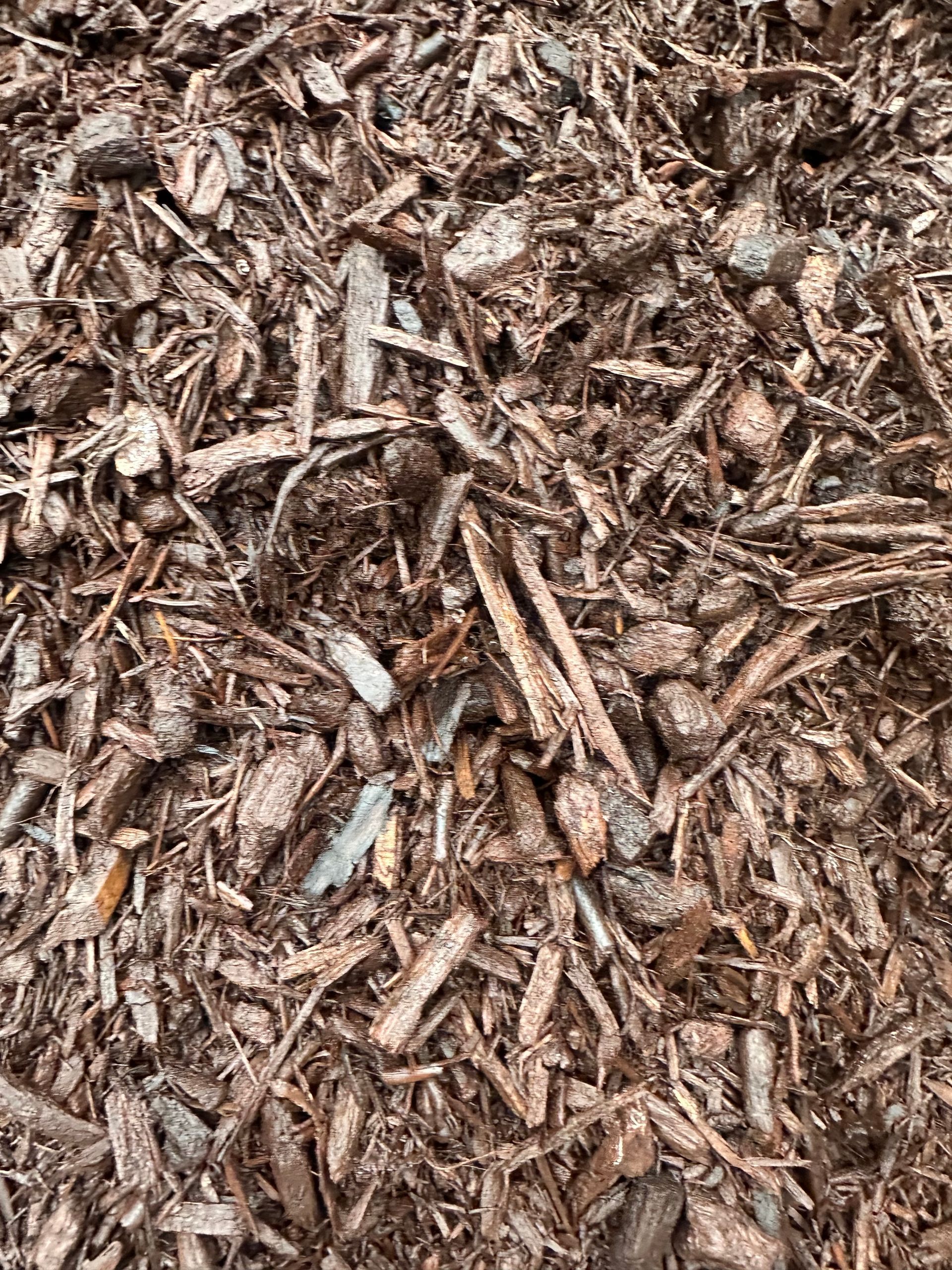 Brown shredded wood mulch.